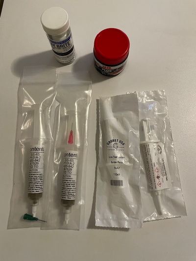 This lot includes five unused containers with soldering paste for Silver and a small jar of flux. Th...