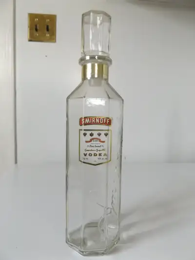 This is an original vintage Smirnoff vodka glass bottle Decanter. There is 'Smirnoff' autograph embo...
