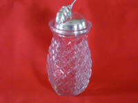 Press glass jar with silver coloured apple lid