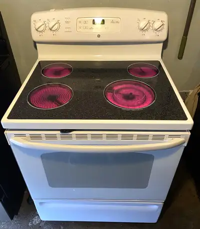 white GE self clean stove 30 day warranty can deliver, View more