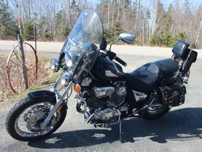 1999 Yamaha Virago Special 1100. Includes double saddle bags & rear bag, stereo, tank bra. New tires...