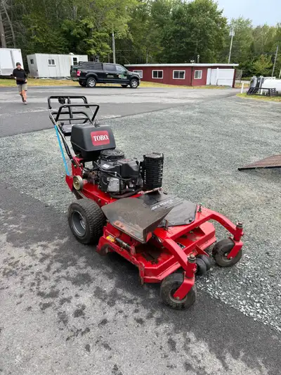 2 toro walk behinds, View more