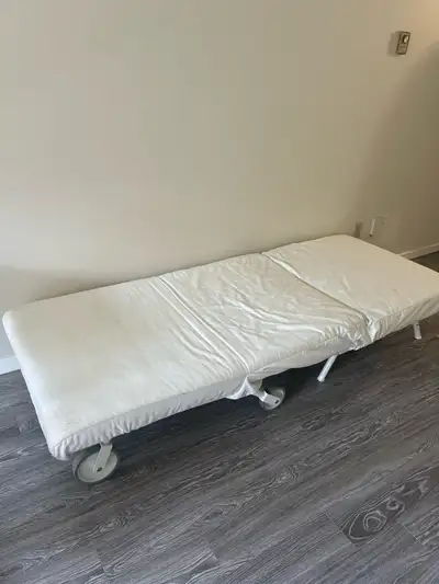 IKEA Lycksele single chair/bed, can fold into a chair or folds flat for a futon/cot/twin bed. Simila...