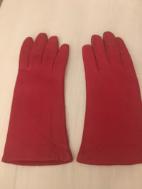 Woman’s red leather gloves