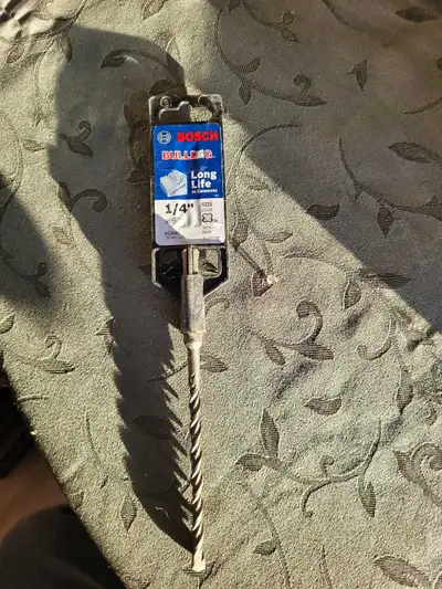 This is a Bosch Bulldog 1/4 inch drill bit, designed for long life in concrete. It is ready for your...