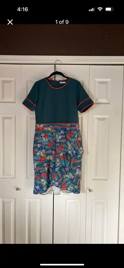 New without tag Small high low front with a ruffle Pine green color with orange trim Size medium Pit...