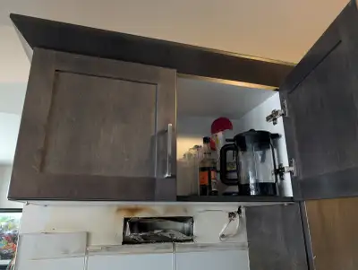 Dark Brown Kitchen Cabinets from a galley kitchen. Lower cupboards 2x30 on dishwasher side, a single...