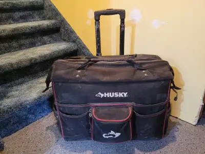 Used Husky Pro Grade Rolling Tote that's heavy-duty telescoping handle and three rugged, steel-reinf...