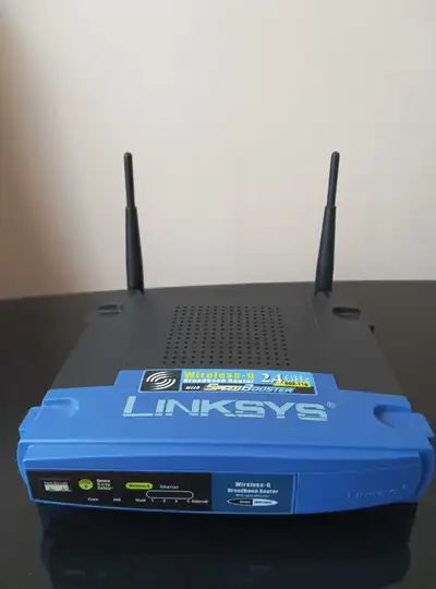 I'm selling a used Linksys Wireless-G 2.4GHz Broadband Router with SpeedBooster, model number WRT54G...