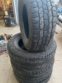 Three Cooper Discoverer AT3 265/70R18 tires