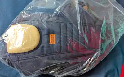 This is a gently used Crinmay Kids baby carrier bag, perfect for keeping your little one close while...