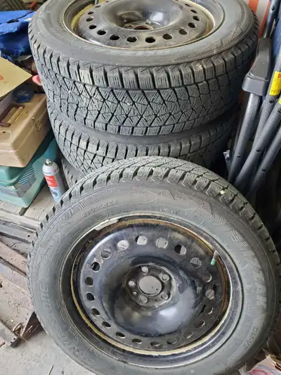 4 used Bridgestone Blizzaks on steel black rims. 225/60R18 Used for only two winter seasons. Lots of...