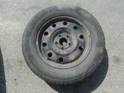 1 General all season tire with steel rim is for sale. Tire is 215/65/15. Rims are 5 holes, 4.5 inch...