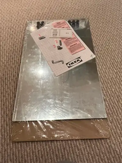 Brand-new IKEA tile mirror - in original package. A total of 4 mirror panels (14 x21.5 in each). The...