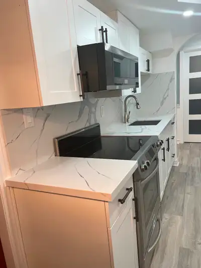 Master bedroom furnished with a bathroom and parking available