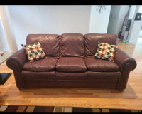  three people,sofas  one is natural leather for $200 and the oth