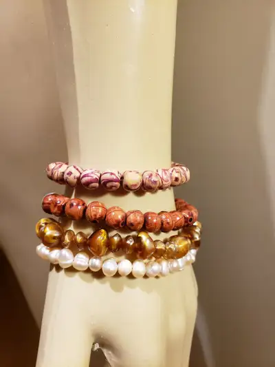 Each wooden bracelet is handmade and has an elastic chord