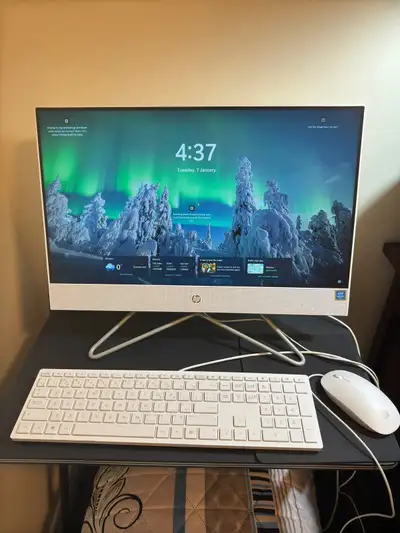 White HP all-in-one desktop computer. Includes matching keyboard and mouse. Minimalist design. Great...