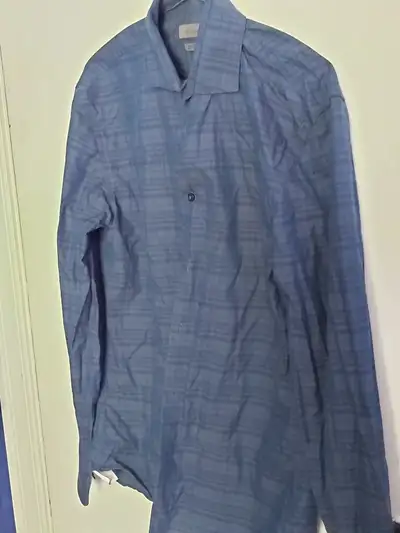 Hello, I am selling a men's dress shirt that I wore ONLY ONCE! It is from Calvin Klein and it is a d...