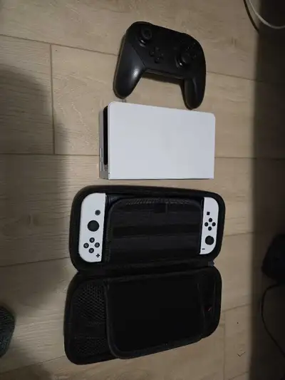 Nintendo Switch OLED, case and pro controller, View more