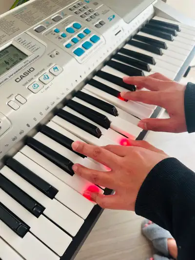 Excellent lighted piano keyboard with stand, View more