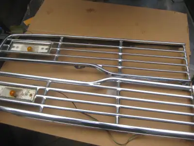 1957 FORD chrome grill, fits all models, the chrome is in immaculate condition, been stored inside f...