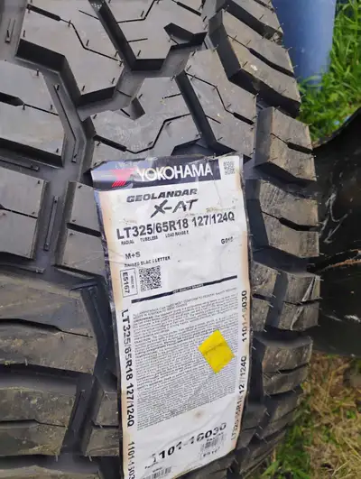 325 65 r18 new Yokohama geolander Also have 8 bolt ram off sets 300 with rubber