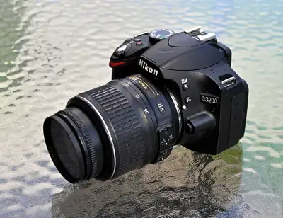 NIKON D3200  (with or without) NIKON 18-55mm or 18-105mm (D7000), View more