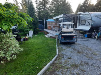 Camper and site at Cedar Shades Campground