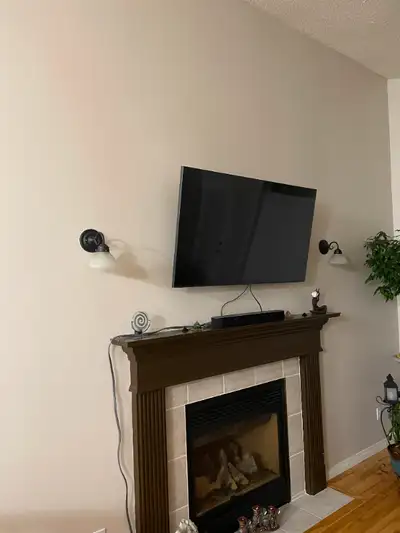 Two wall scones light fixtures. Black frame with off white 6-3/4" diameter lenses. All mounting hard...