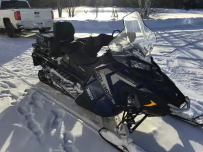 Polaris Titan for sale in Cochrane 800 2020 mileage 2856. Has electric start, reverse & hand warmer...