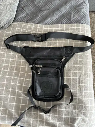 Motorcycle leg bag. Wear around your waist and leg or over the shoulder. New never used .
