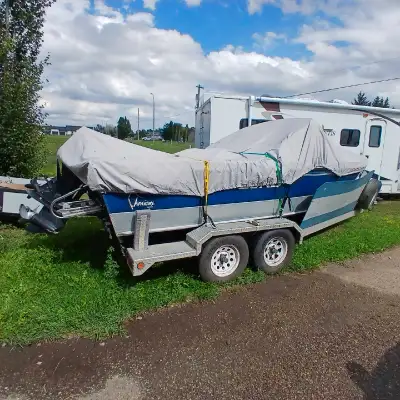This is an 18ft Lund Adventure, perfect for fishing or family fun on the lake. While it's a used boa...