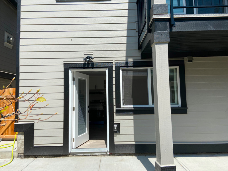 A new legal basement suite with 2 bedrooms on ground level Long Term