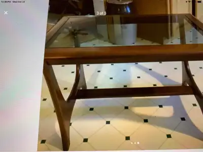 Vintage rectangular teak wood side table with a smoked glass top. Good condition. No chips or cracks...