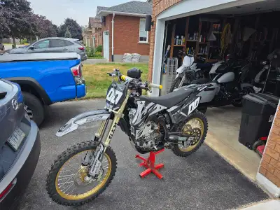 The 450 had its engine rebuild 2 years ago. It has the white plastics, Still have 4 hours on it. Alo...