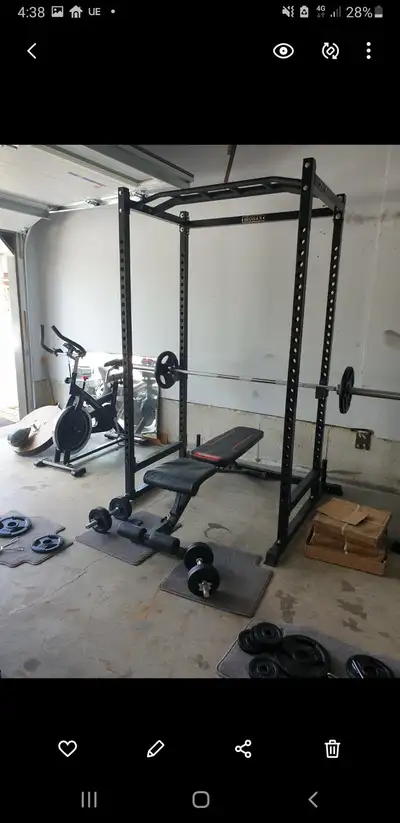 Elevate your home gym with this robust Titan Fitness power rack, complete with an adjustable bench,...