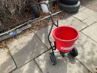 Barrel fertilizer spreader