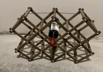 This folding wooden wine rack is a stylish and practical way to store your favourite wines. It featu...