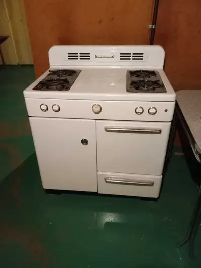 Vintage AMC gas stove for sale. White. 4 burners. Oven compartment and storage for pots and pans. Wi...