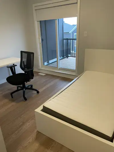 Private furnished bedroom with private bathroom in a newly constructed modern 2 bedroom stacked cond...