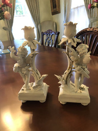 Pair of antique cherub white biscuit porcelain candlesticks 