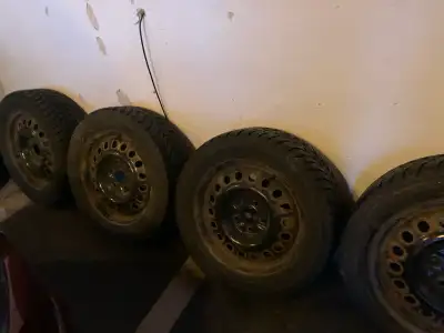 4 rims & 4 tires in the set. Need to make room in my garage.