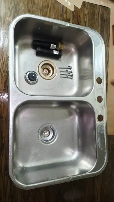 Double bowl sink made of thick, heavy-duty stainless steel (31" W x 20.5" D overall, including the o...
