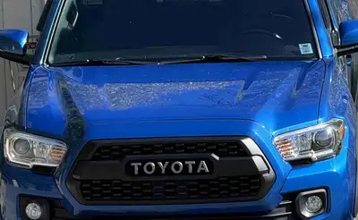 Tacoma TRD OffRoad hood for sale in Blaze Blue. Fits third gen Tacomas 2016-2023. Hood in excellent...
