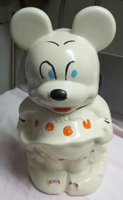 reversible Mickey and Minnie mouse cookie jar. Great Christmas gift for the Cookie monster in your h...
