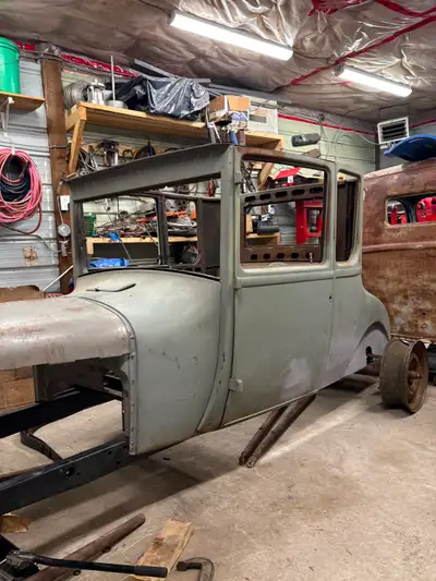 26/27 model t coupe body on a 28 model A frame. Dropped front model A axle. Rear bango axle from 40’...