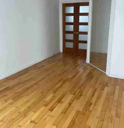 This bright 1-bedroom condo apartment features beautiful hardwood flooring, a modern kitchen with hi...