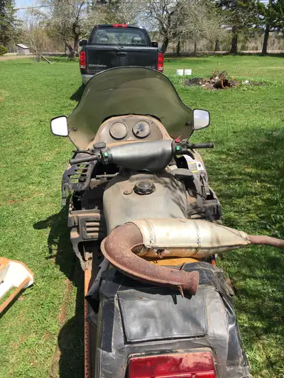 Complete snowmobile for parts. Was riding up until one cylinder lost compression. Dis-assembled and...