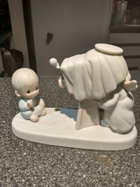 Precious moments Baby's first picture figurine.